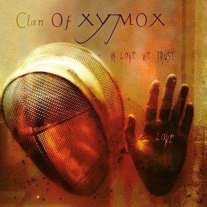 Clan Of Xymox – In Love We Trust (Limited Edition) (Black/Orange Splatter Coloured) (LP)